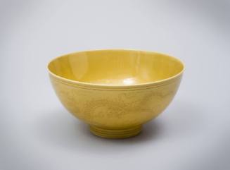 Incised yellow dragon bowl
