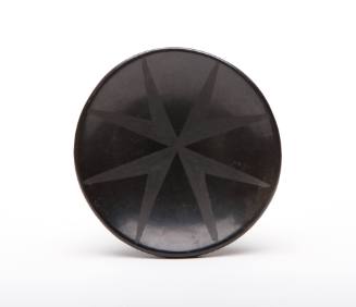 Small black-on-black saucer