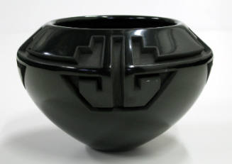 Small polished and carved blackware bowl